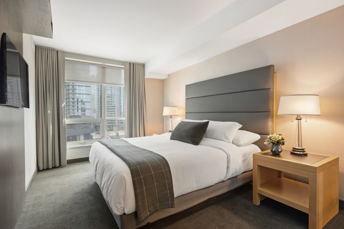 Deluxe hotel room in Guruvayoor with double bed and modern interior
